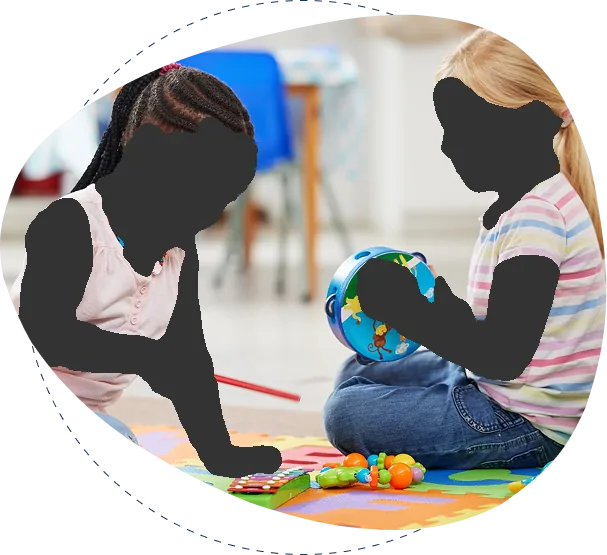Two children playing with toys on the floor